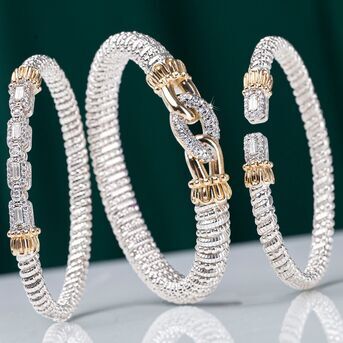 Elevate your stack by mixing in a wide band for a bold, dynamic look. DiamondJewelry StackableBrace